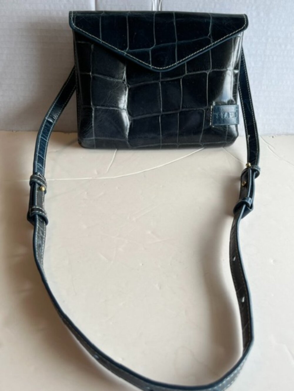 Staud small leather crossbody bag.